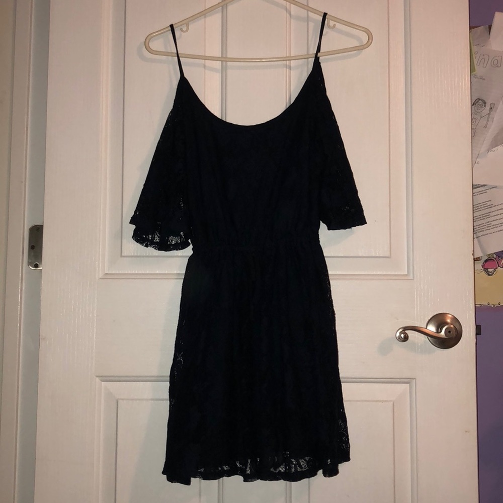 Flowing navy blue dress. Shoulder cut out.